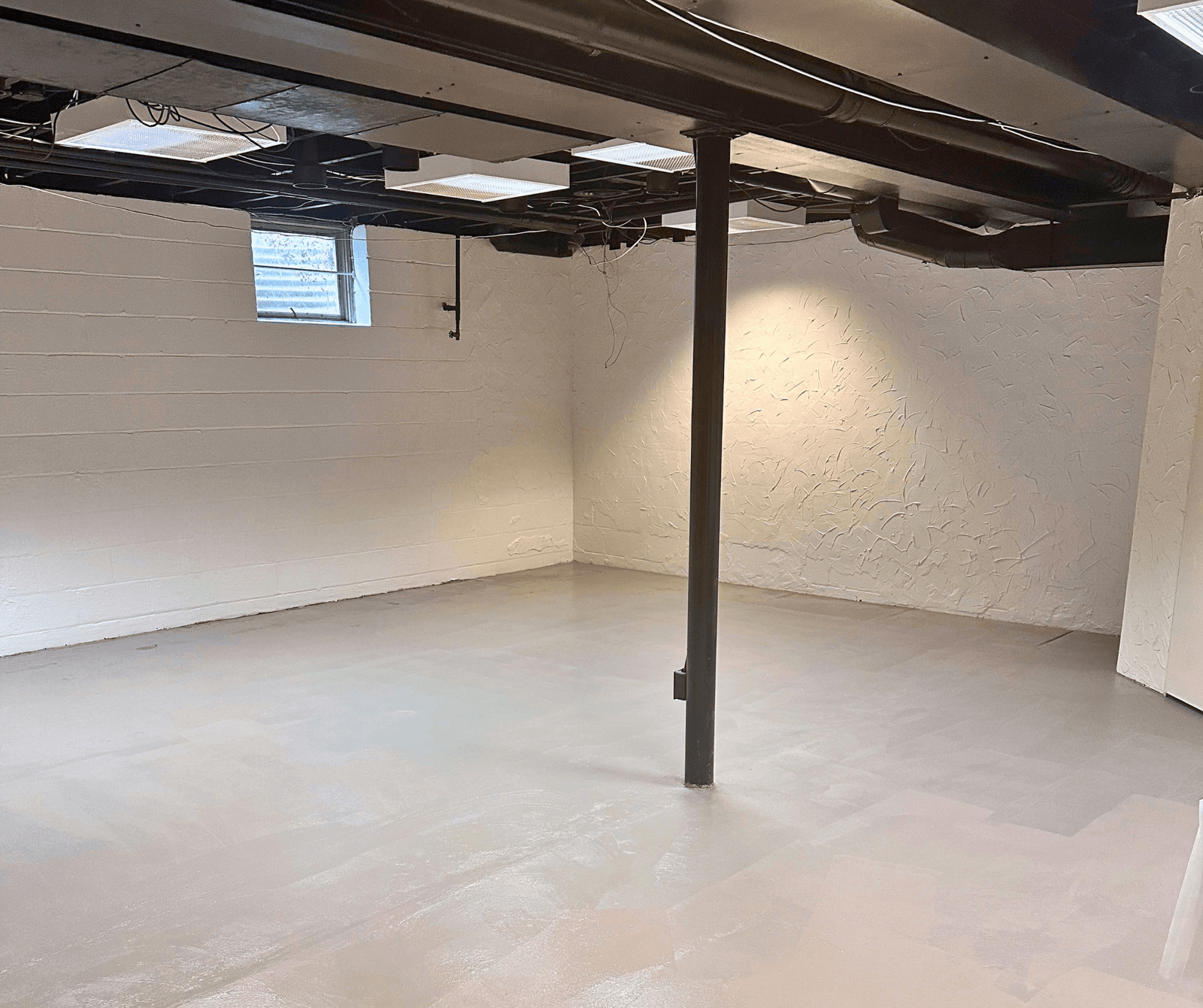 Finished basement with custom walls, LED lighting, and Tred-Plex painted floors by Healthy Spaces Inc.