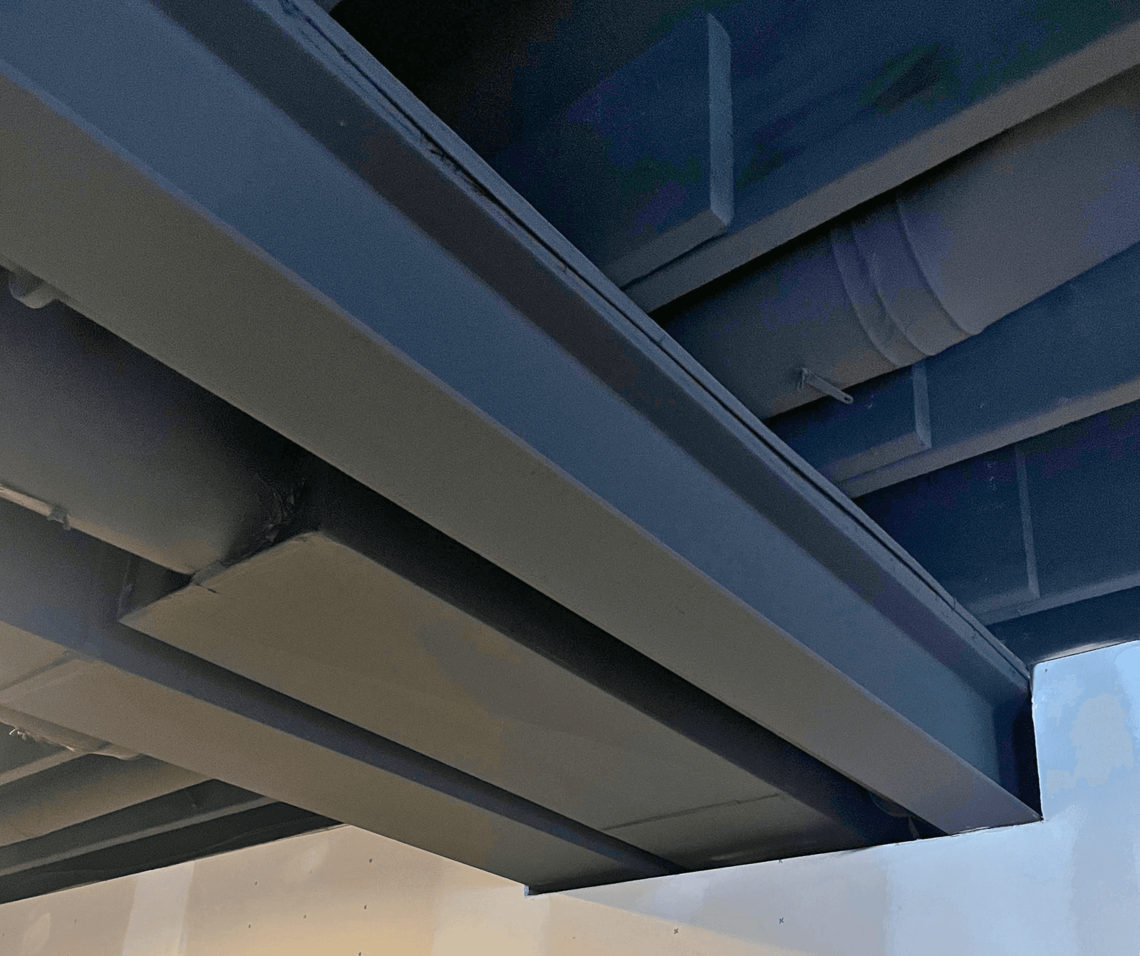 Finished basement ceiling with recessed LED lighting and mold-resistant materials installed by Healthy Spaces Inc.